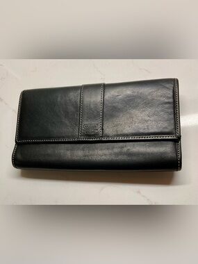 Coach Women’s Lovely rich black leather with stitching accent vintage wallet.